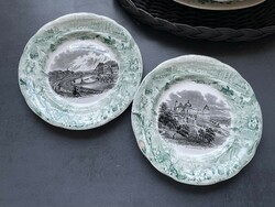 Nicely matured, antique, black and white cityscape, decorated with a green life picture around the earthenware plates