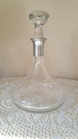 Old glass decanter with silver-plated metal fittings