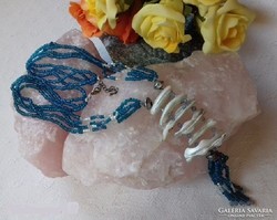 Real term. Decorative shell necklace with lots of neon blue apatite pearls