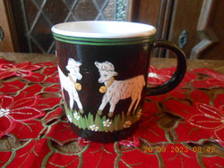 Handmade ceramic mug with hand-painted lamb motifs