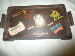 Old wooden serving tray with drink labels