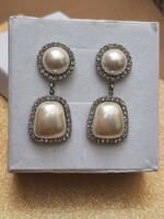 Pearl earrings, richly filled with zircons