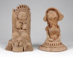 Pair of unglazed ceramic figurines marked 1O733