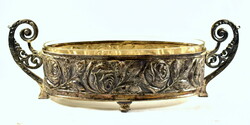 XX. No. The front has a beautiful antique patina silver-plated rose patterned glass tray