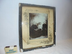 Antique family photo in a frame, under glass