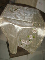 A special floral tablecloth with beautiful handmade ribbon embroidery