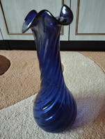 Artistic vase of blown, broken slightly iridescent blue glass
