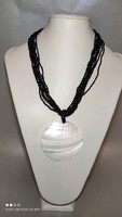 Tiny black pearl multi-row necklace with mother-of-pearl shell pendant