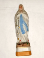 Antique statue of the Virgin Mary of Lourdes.