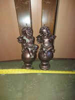 2 bronze-coated putto wax candles