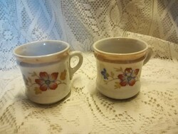 Two identical mini mugs, with a lustrous rim, sometimes with wear