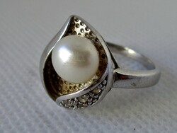 A beautiful sterling silver ring with genuine pearls