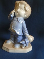 A yawning little boy, in a very fine German porcelain display case, a true collector's rarity