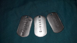 Old metal, maybe military tickets, 