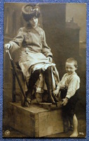 Antique photo postcard - lady and the little shoeshine boy