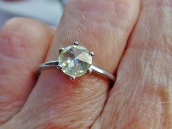 A beautiful silver ring with a special rose-cut moissanite diamond