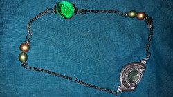 Magical esoteric stone sun and moon runes strung on a chain as shown in the pictures