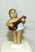 A rare Aquincum porcelain figure. Creole singing girl with banjo -