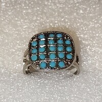 Adjustable ring with turquoise colored crystal stones