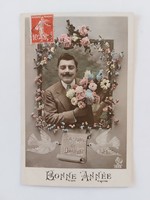 Old postcard 1910 photo postcard with a man's bouquet of flowers