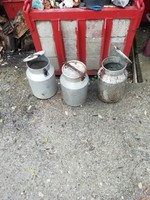 Old large milk jugs in the condition shown in the pictures