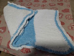 Hand-knitted baby blanket is a unique handcrafted product