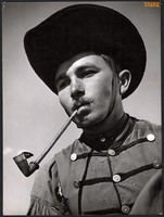 Larger size, photo art work by István Szendrő. Young man with a pipe, colt(?), 1930s
