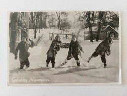 Old postcard photo postcard children making snowballs