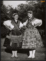 Larger size, photo art work by István Szendrő. Women, in Báta folk costume, with glass.