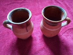 Pair of folk ceramic jugs, mugs, mugs and straws