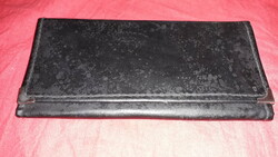 Old black leather waiter's wallet 