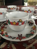 Coffee cups with their plates with Christmas decor