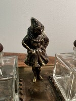 Brass clown girl on tray with glass containers