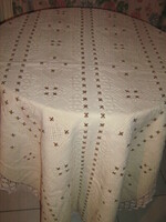 Beautiful embroidered elegant tablecloth with hand-crocheted edges