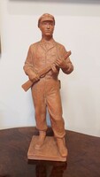 A terracotta statue of a watchman, the work of a black geza sculptor