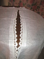 A pair of beautiful vintage white stained glass curtains with hand crocheted edges