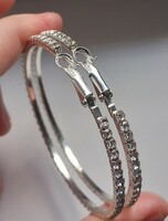 Silver-plated rhinestone hoop earrings.