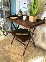 Folding table with tray.