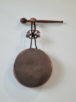 Old copper/tinted applied art gong/wall decoration with wooden beater