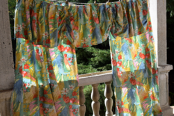 A pair of blackout curtains and a pair of draperies are special features