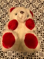 A new, snow-white teddy bear. With red ears and red paws. Made in Korea. Great for a Christmas present.