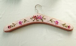 Hanger covered with tapestry