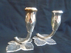 Individual candle holders resting on grape leaves are thickly silvered and marked pieces