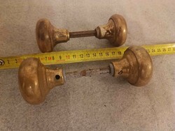 A pair of art deco brass doorknobs