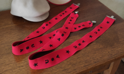 Red usa-labeled suspenders, costume accessory from Inke László's legacy