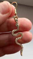 Gold-plated rhinestone snake earrings.