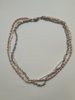 Old designer necklaces in three colors: white, pink, blue pearl necklaces!