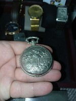 Pocket watch depicting horse jockeys