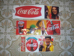 Three retro Coca-Cola advertising stickers together