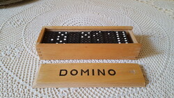 28 dominoes in an old wooden box.